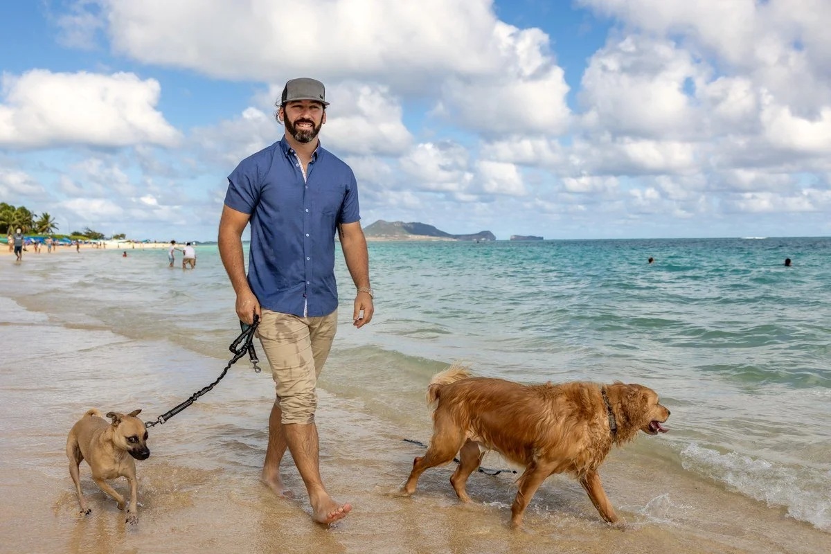 Ryan Adams walking his two dogs at Lanikai Beach