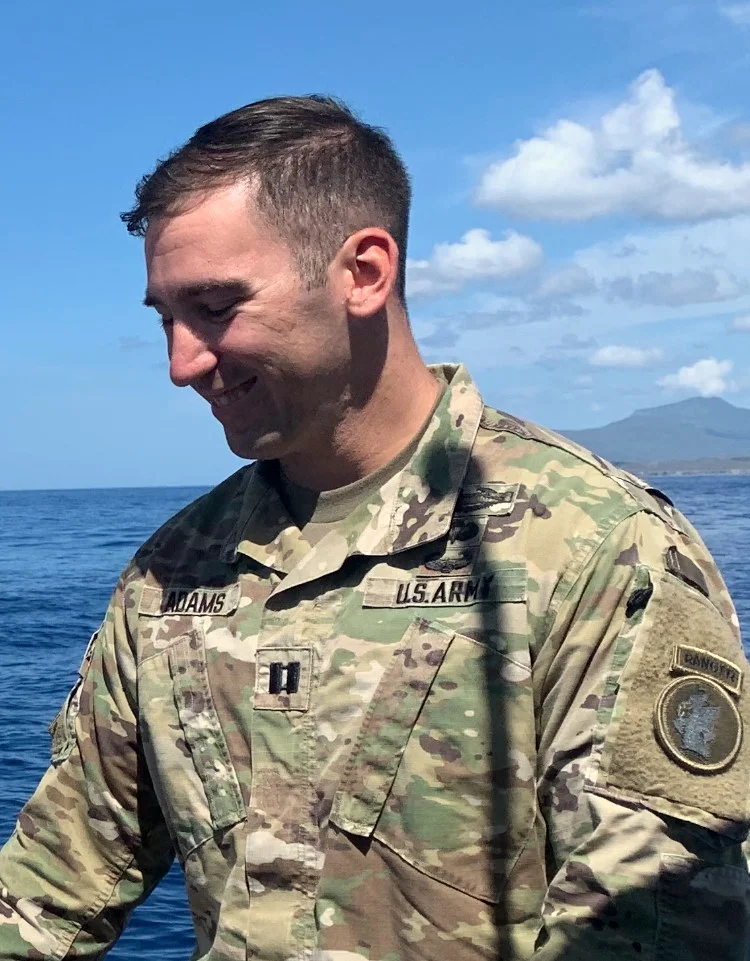 Ryan Adams in Army uniform beside the ocean